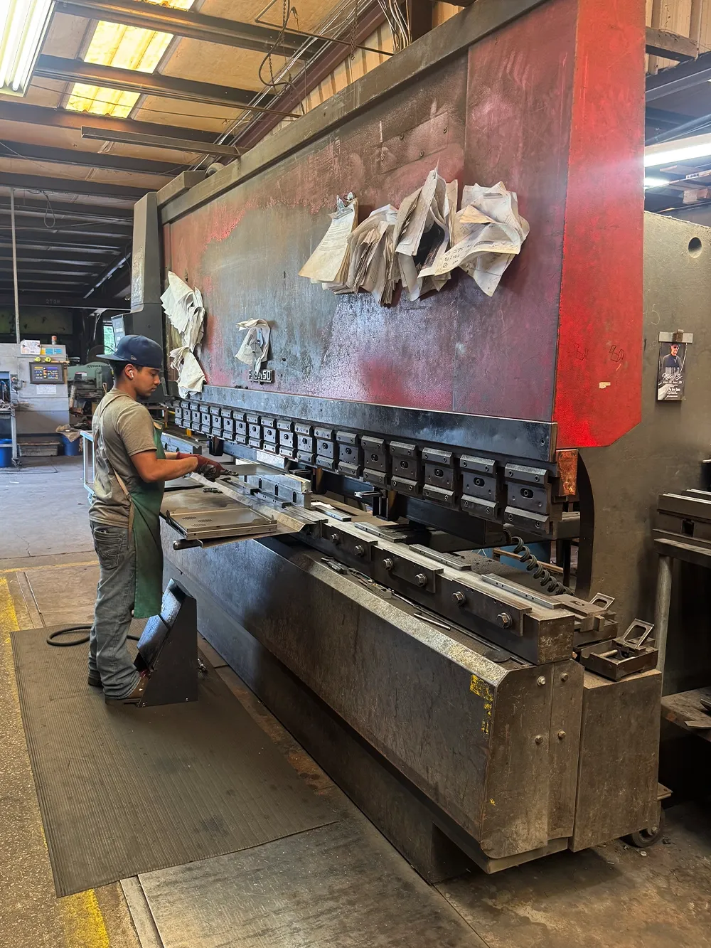 An Edwards Equipment fabricator at work on the Birmingham shop floor