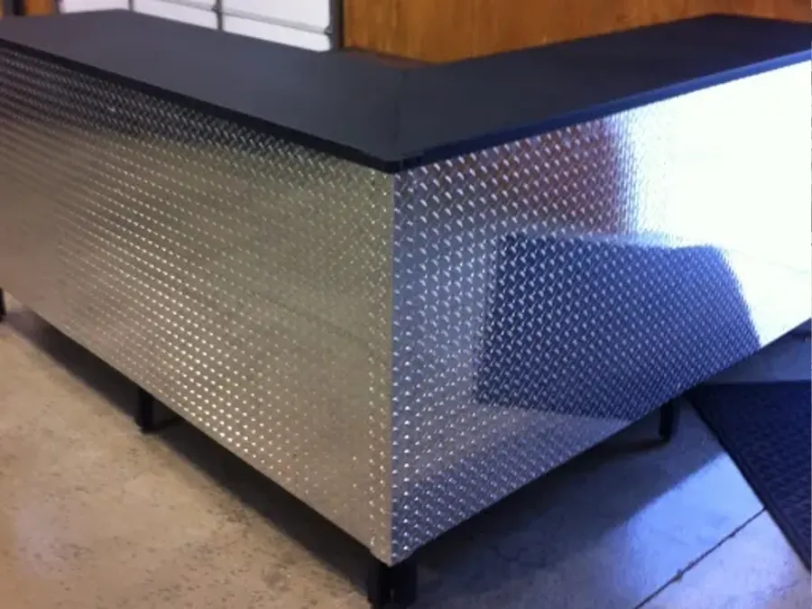 Custom steel table with diamond plate top
